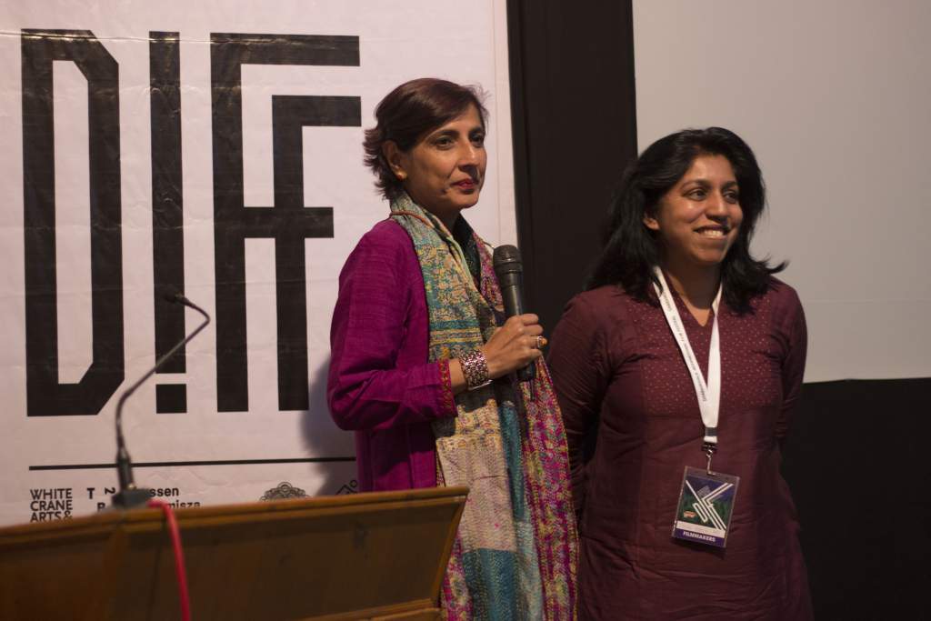 Jyothi Kapur Das addressing the audience with Ritu Sarin after the world premiere of Chutney at DIFF